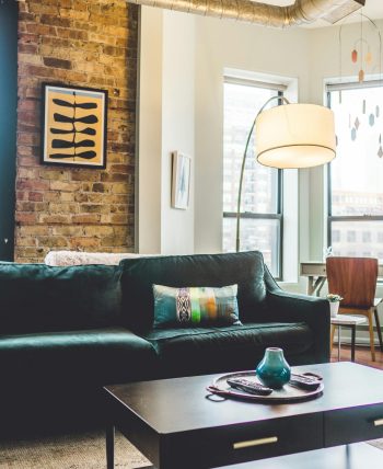 pexels-photo-1918291-1918291 Contemporary living room with elegant decor and cozy furniture in urban setting.
